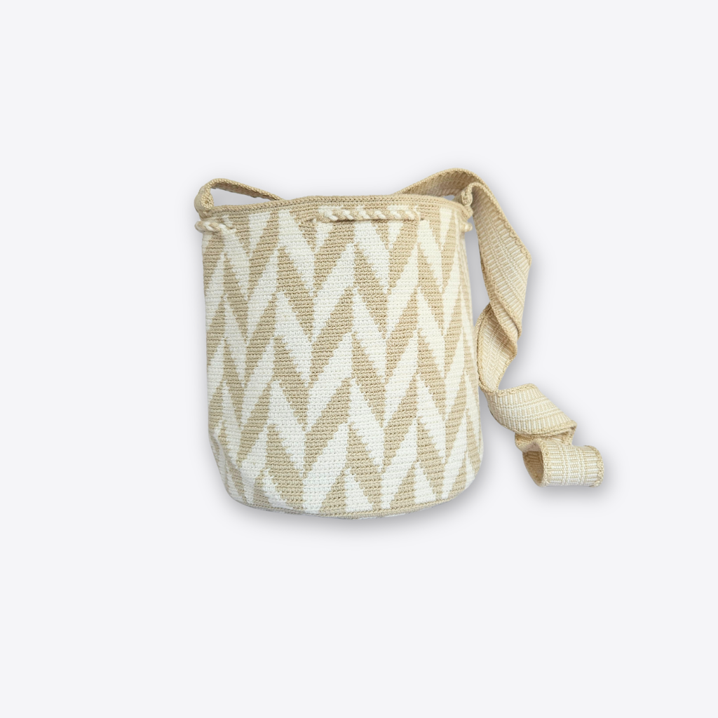 A woven bucket bag with a beige and off-white chevron pattern, featuring a matching adjustable shoulder strap, set against a plain light gray background.
