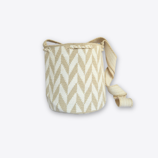 A woven bucket bag with a beige and off-white chevron pattern, featuring a matching adjustable shoulder strap, set against a plain light gray background.